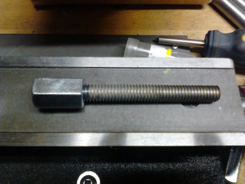 Threaded rod with coupling nut joined by thread locker