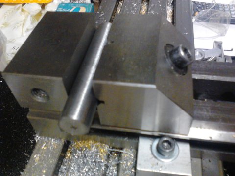 Steel rod in milling vise